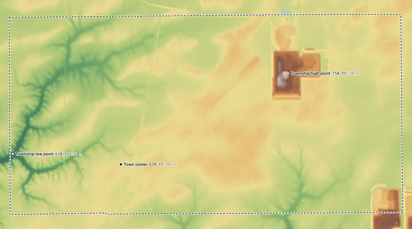 Topographic elevation map of Girard Township, Illinois, shaded from 620 ft on the west side to 750 ft on the northeast side