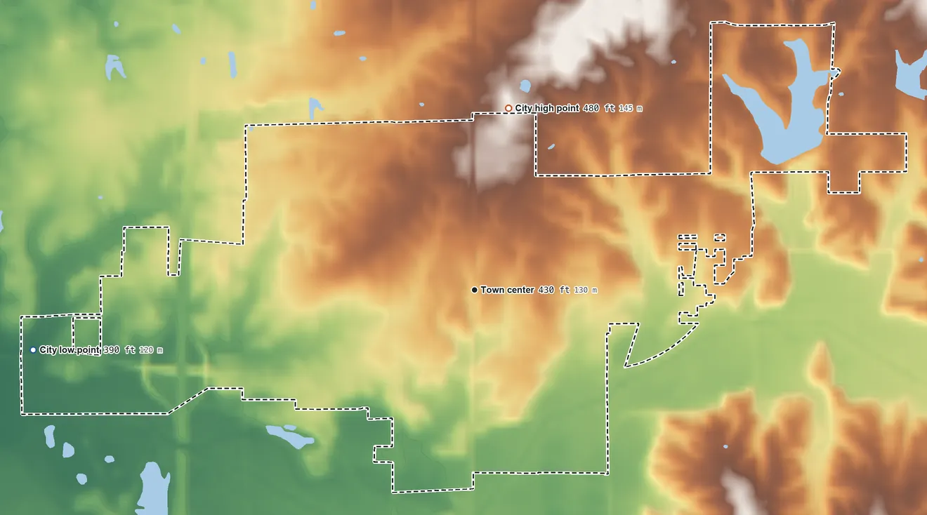 Topographic elevation map of Johnston City, Illinois, shaded from 390 ft on the west side to 480 ft on the north side