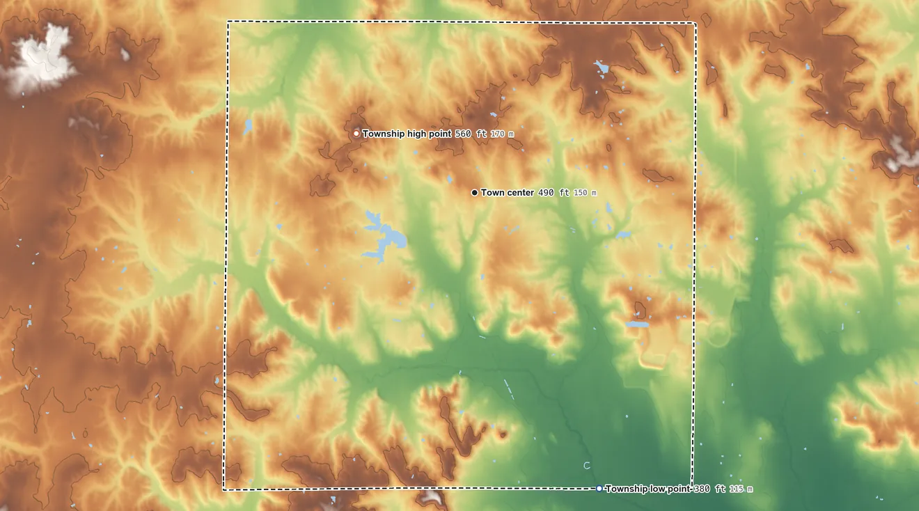Topographic elevation map of McLeansboro Township, Illinois, shaded from 380 ft on the southeast side to 560 ft on Radio Hill