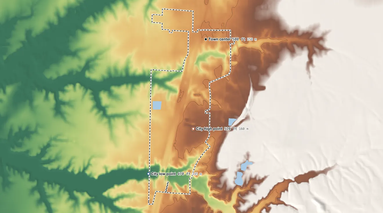 Topographic elevation map of Wamac, Illinois, shaded from 470 ft on the southwest side to 520 ft on the south side