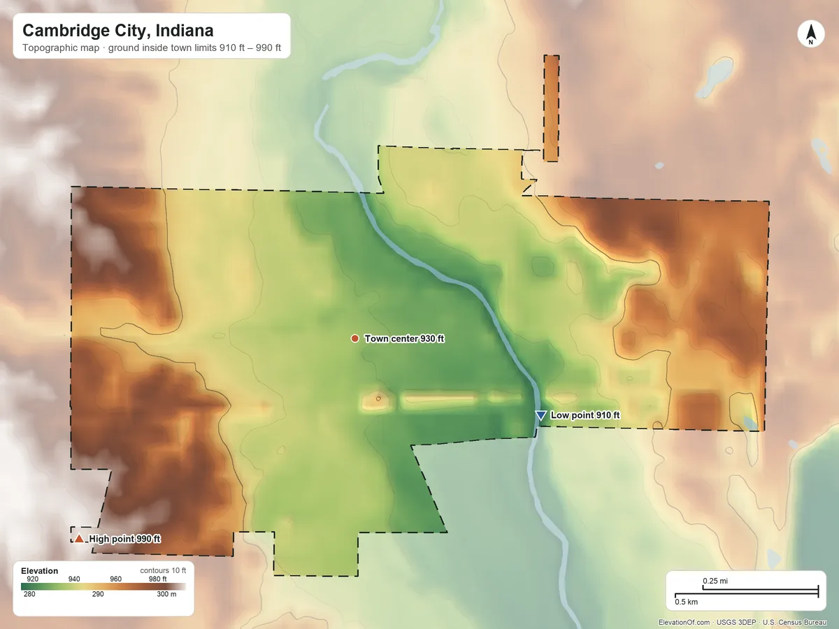 Topographic elevation map of Cambridge City, Indiana, shaded from 910 ft on the east side to 990 ft on the southwest side