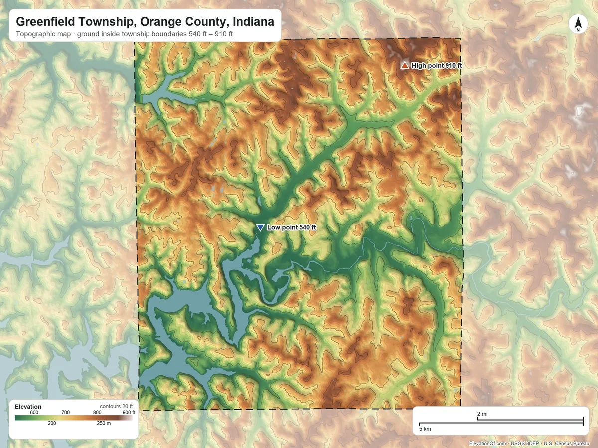 Topographic elevation map of Greenfield Township, Orange County, Indiana, shaded from 540 ft on the southwest side to 910 ft on the northeast side