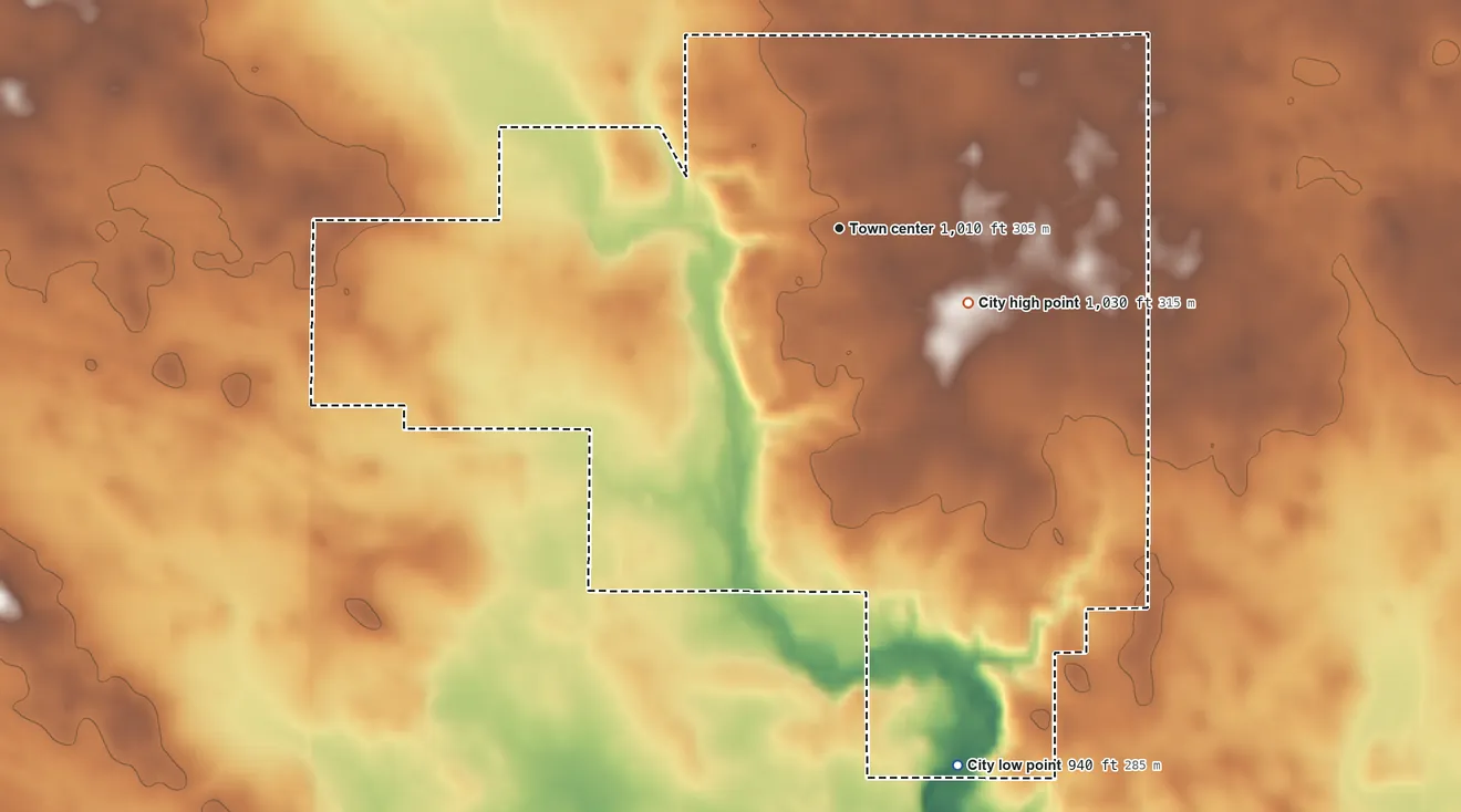 Topographic elevation map of Alleman, Iowa, shaded from 940 ft on the south side to 1,030 ft on the southeast side