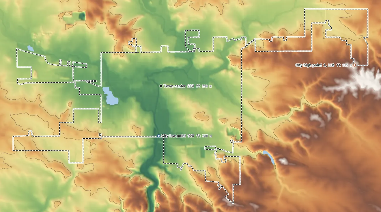 Topographic elevation map of Dyersville, Iowa, shaded from 920 ft on the south side to 1,110 ft on the east side