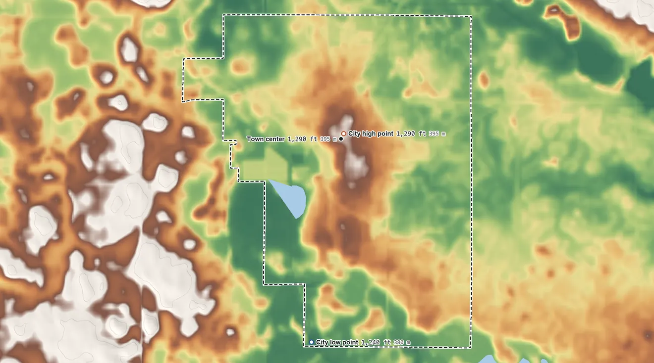 Topographic elevation map of Lake Mills, Iowa, shaded from 1,240 ft on the south side to 1,290 ft near the middle