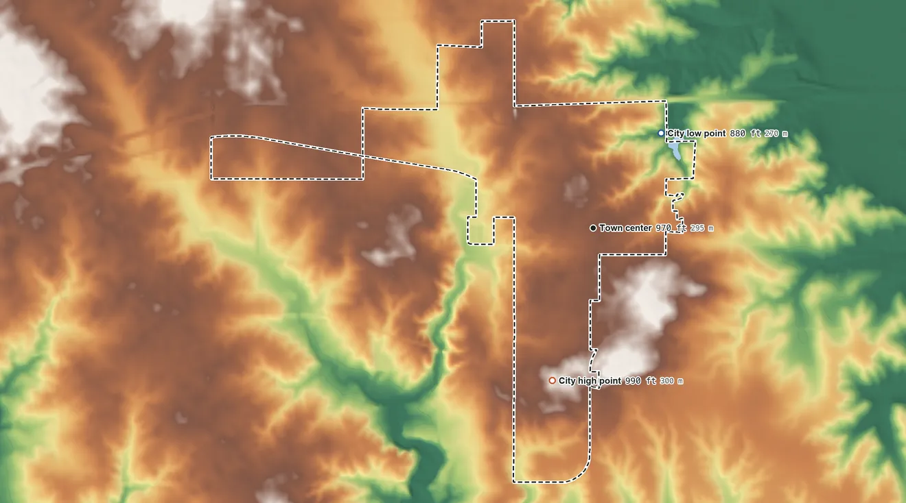 Topographic elevation map of Mitchellville, Iowa, shaded from 880 ft on the northeast side to 990 ft on the south side