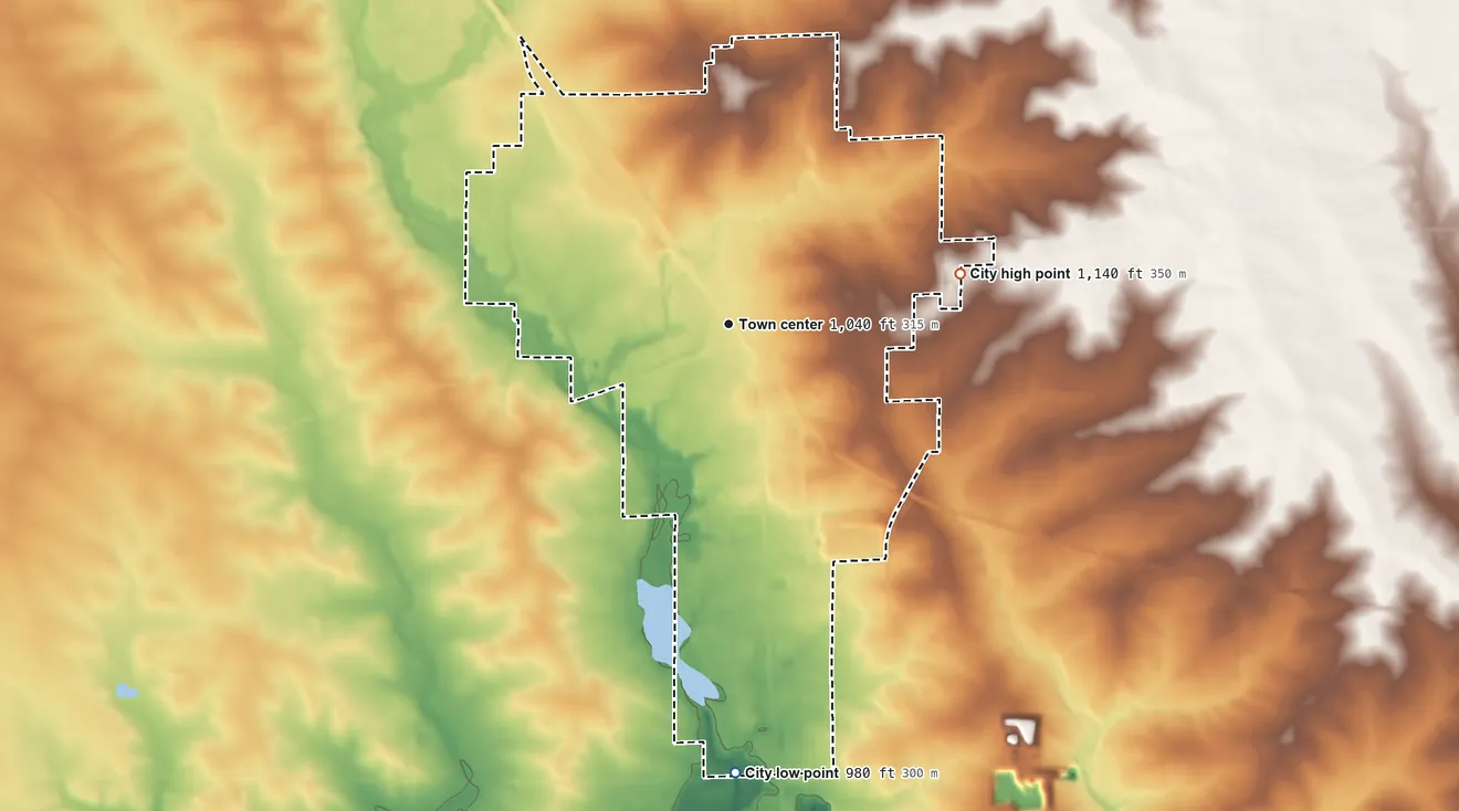 Topographic elevation map of Oelwein, Iowa, shaded from 980 ft on the south side to 1,140 ft on the east side