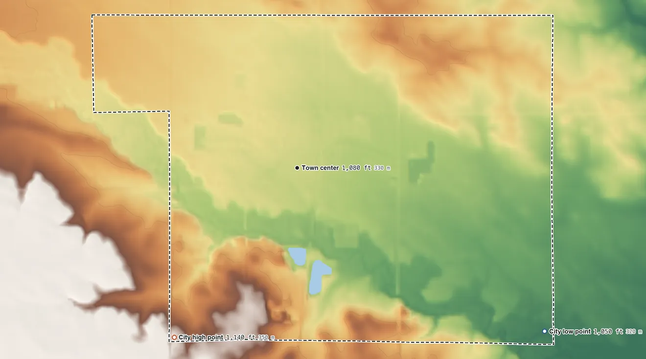 Topographic elevation map of Sheffield, Iowa, shaded from 1,050 ft on the southeast side to 1,140 ft on the southwest side