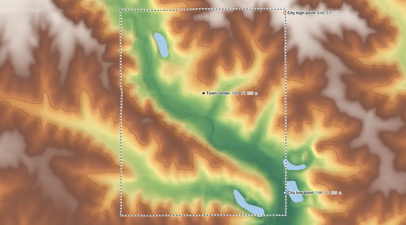Topographic elevation map of What Cheer, Iowa, shaded from 740 ft on the southeast side to 840 ft on the northeast side