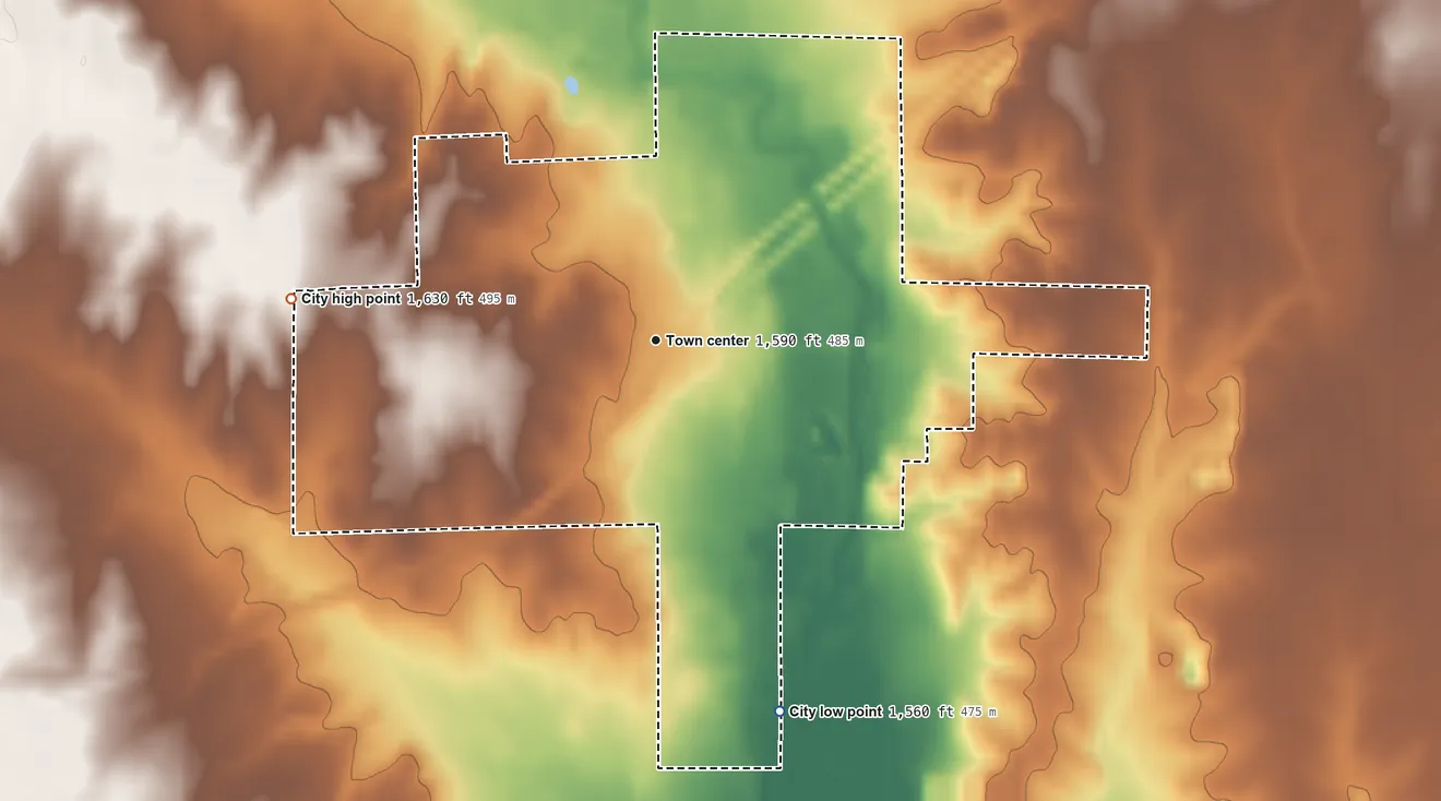 Topographic elevation map of Arlington, Kansas, shaded from 1,560 ft on the south side to 1,630 ft on the west side