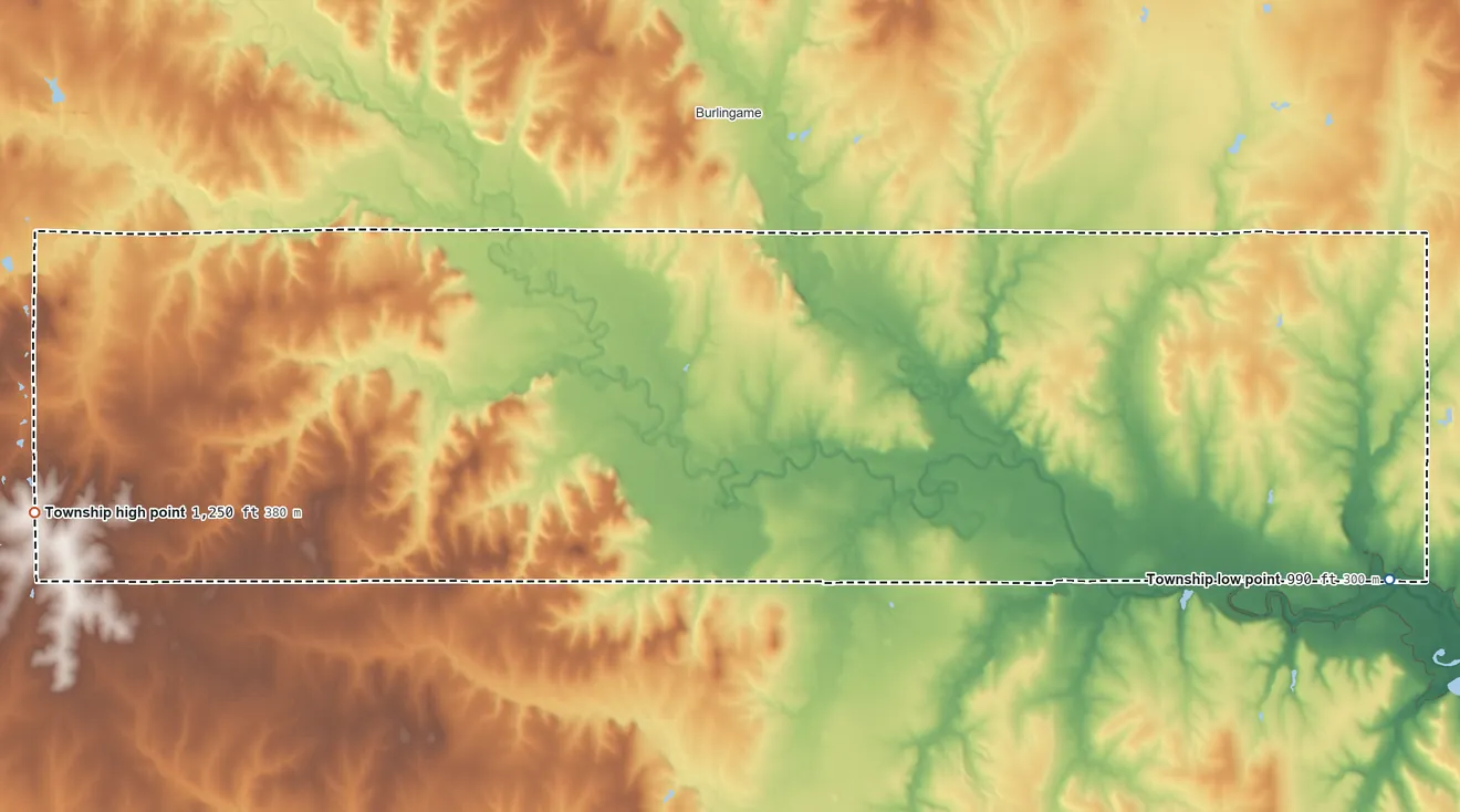 Topographic elevation map of Dragoon Township, Kansas, shaded from 990 ft on the east side to 1,250 ft on the west side