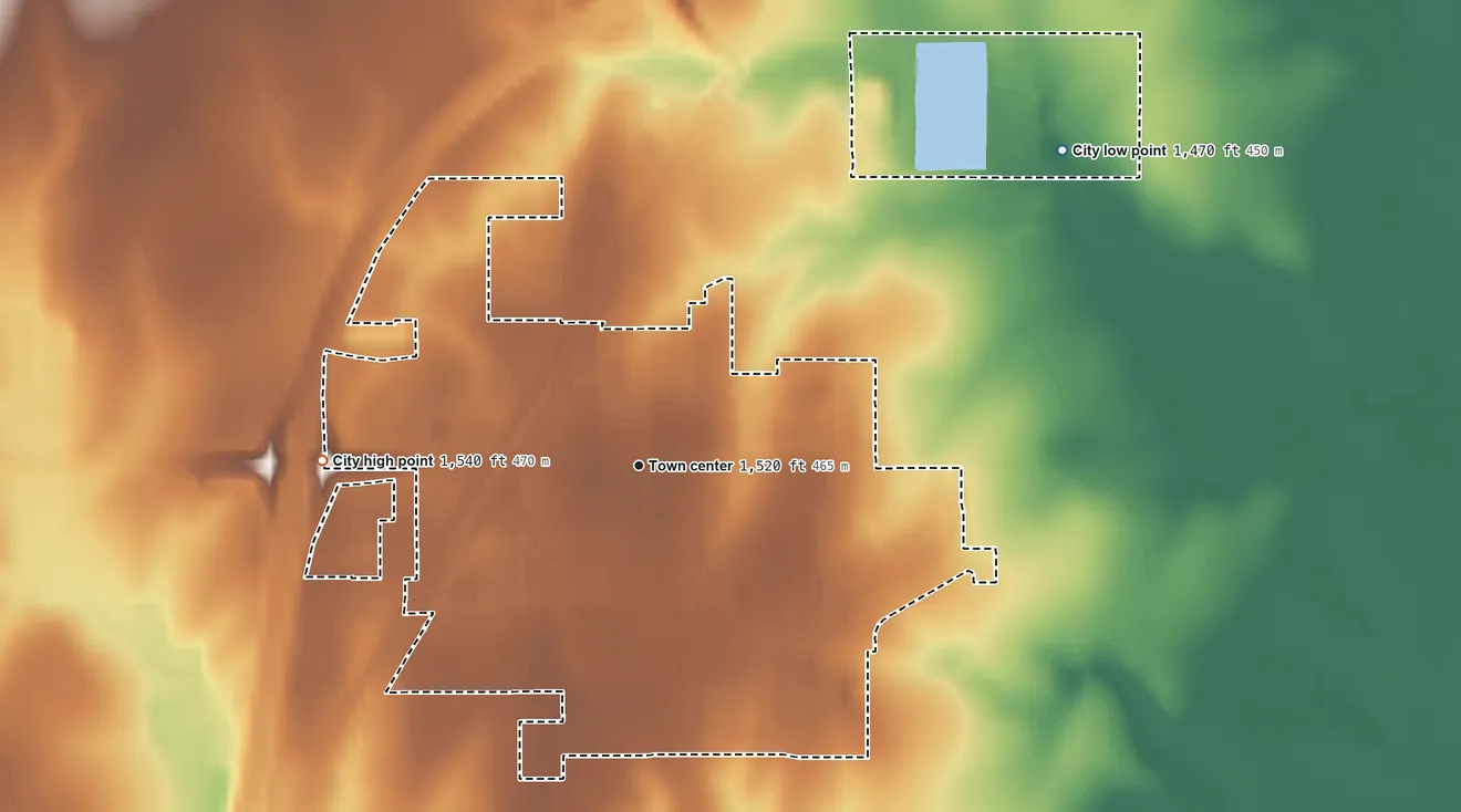 Topographic elevation map of Inman, Kansas, shaded from 1,470 ft on the northeast side to 1,540 ft on the west side