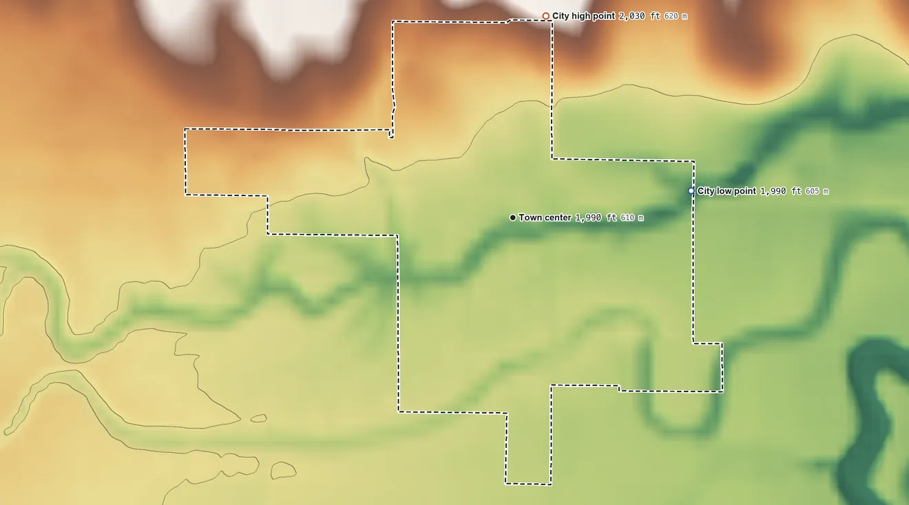 Topographic elevation map of Rush Center, Kansas, shaded from 1,990 ft on the east side to 2,030 ft on the north side