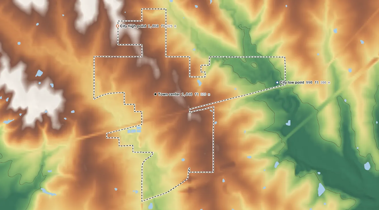 Topographic elevation map of Wellsville, Kansas, shaded from 990 ft on the east side to 1,060 ft on the northwest side