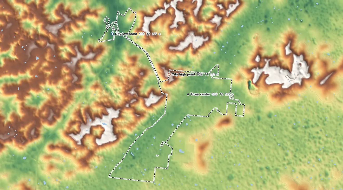 Topographic elevation map of Horse Cave, Kentucky, shaded from 580 ft on the northwest side to 910 ft on Gossett Knob