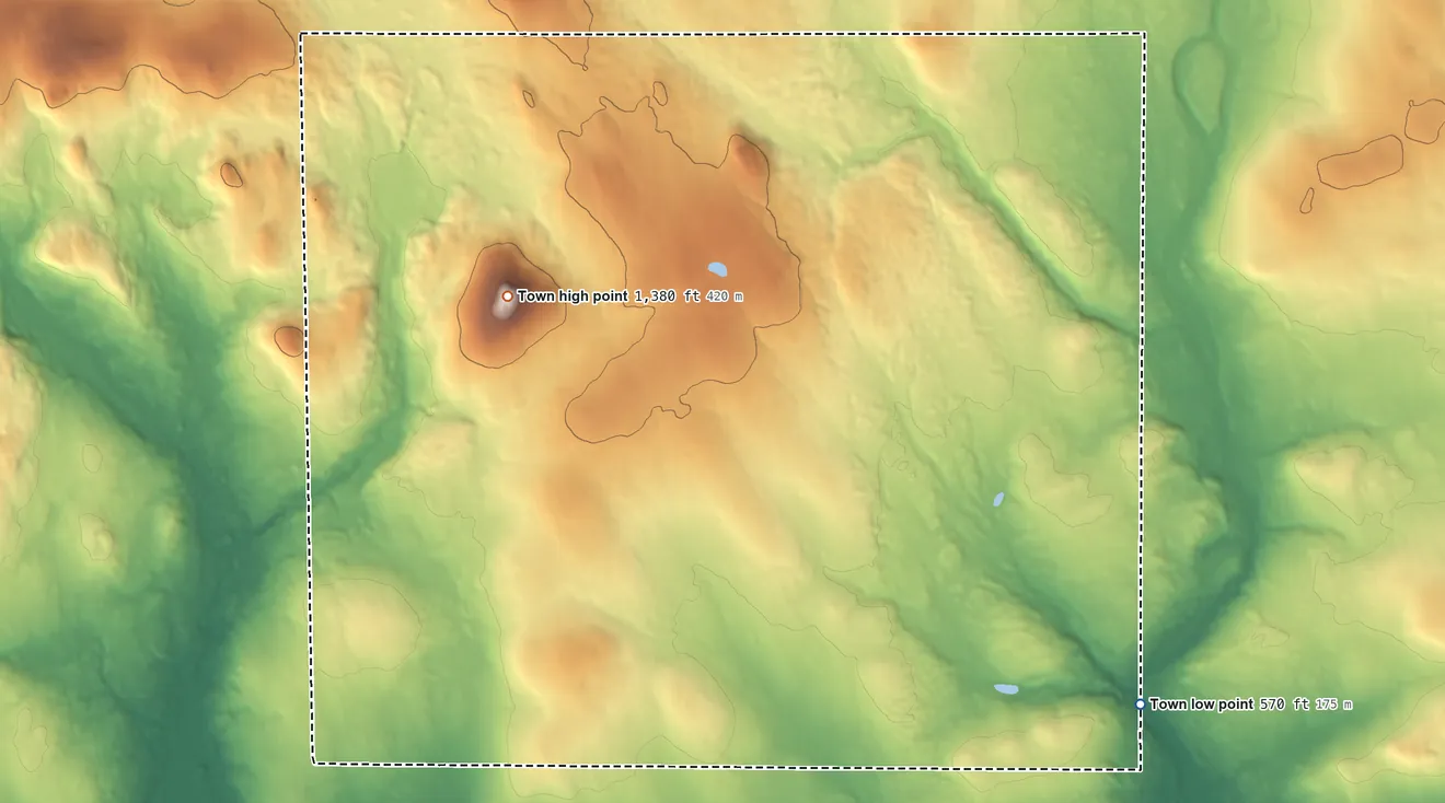 Topographic elevation map of Merrill, Maine, shaded from 570 ft on the southeast side to 1,380 ft on Sholler Mountain