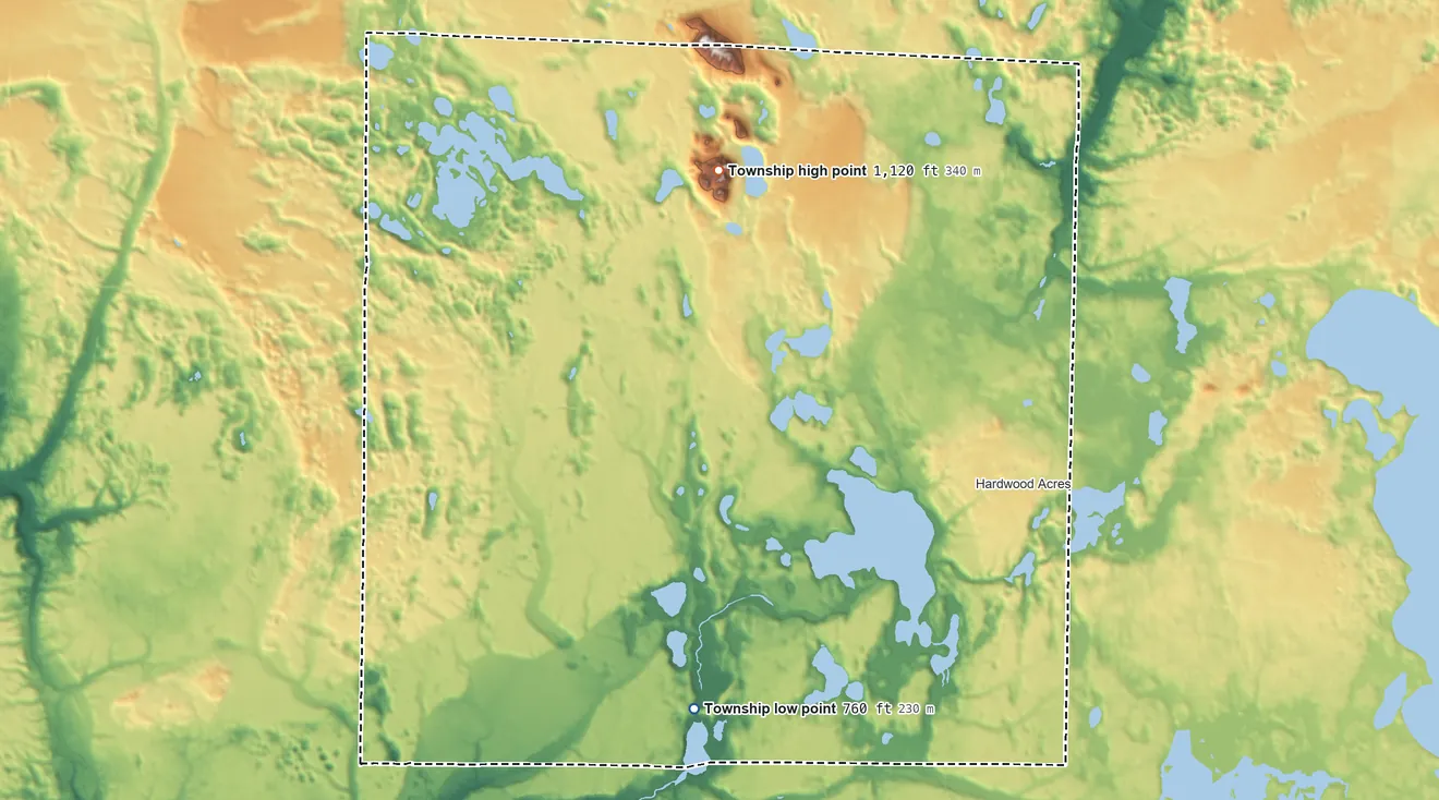 Topographic elevation map of Almira Township, Michigan, shaded from 760 ft on the south side to 1,120 ft on Warner Hill
