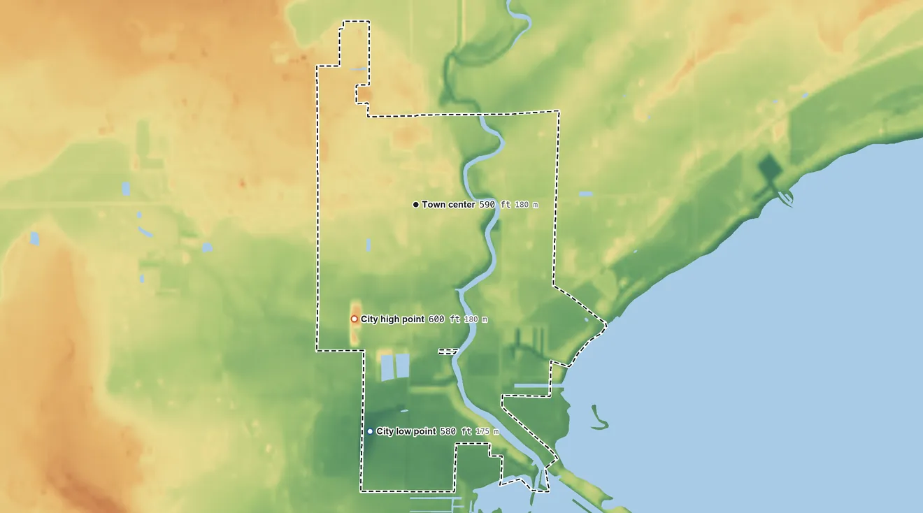 Topographic elevation map of Au Gres, Michigan, shaded from 580 ft on the south side to 600 ft on the southwest side
