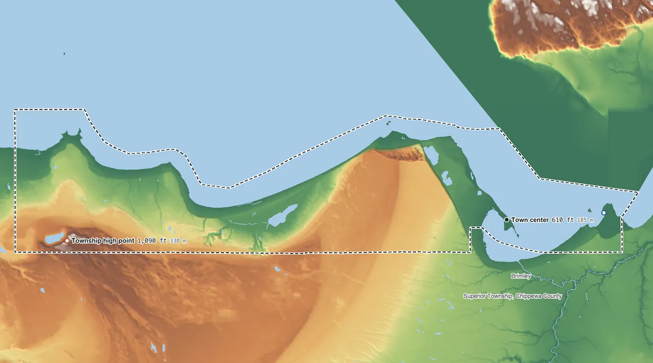 Topographic elevation map of Bay Mills Township, Michigan, shaded from 600 ft on the east side to 1,090 ft on the west side