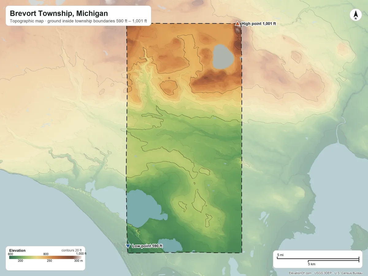 Topographic elevation map of Brevort Township, Michigan, shaded from 590 ft on the southwest side to 1,001 ft on Maple Hill