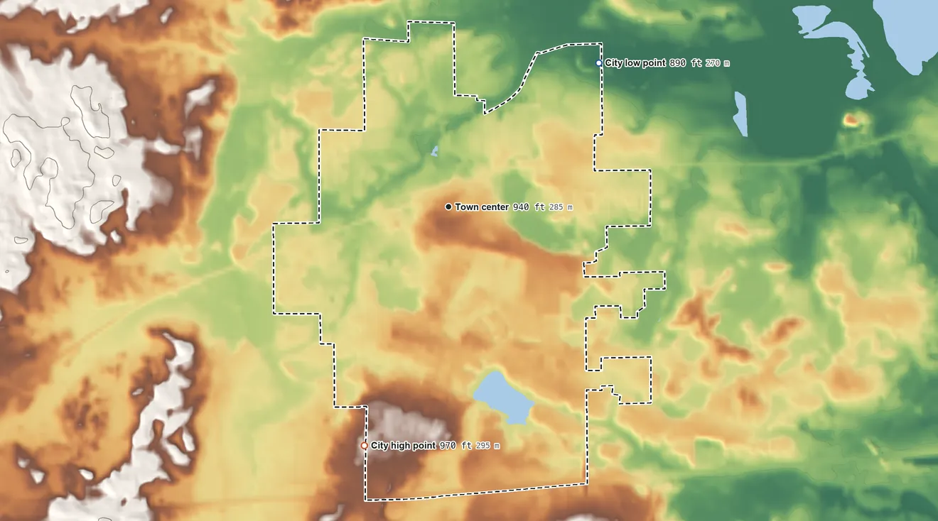 Topographic elevation map of Chelsea, Michigan, shaded from 890 ft on the northeast side to 970 ft on the south side