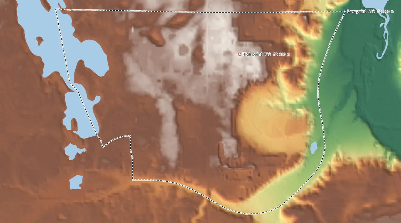 Topographic elevation map of Chums Corner, Michigan, shaded from 690 ft on the east side to 920 ft near the middle