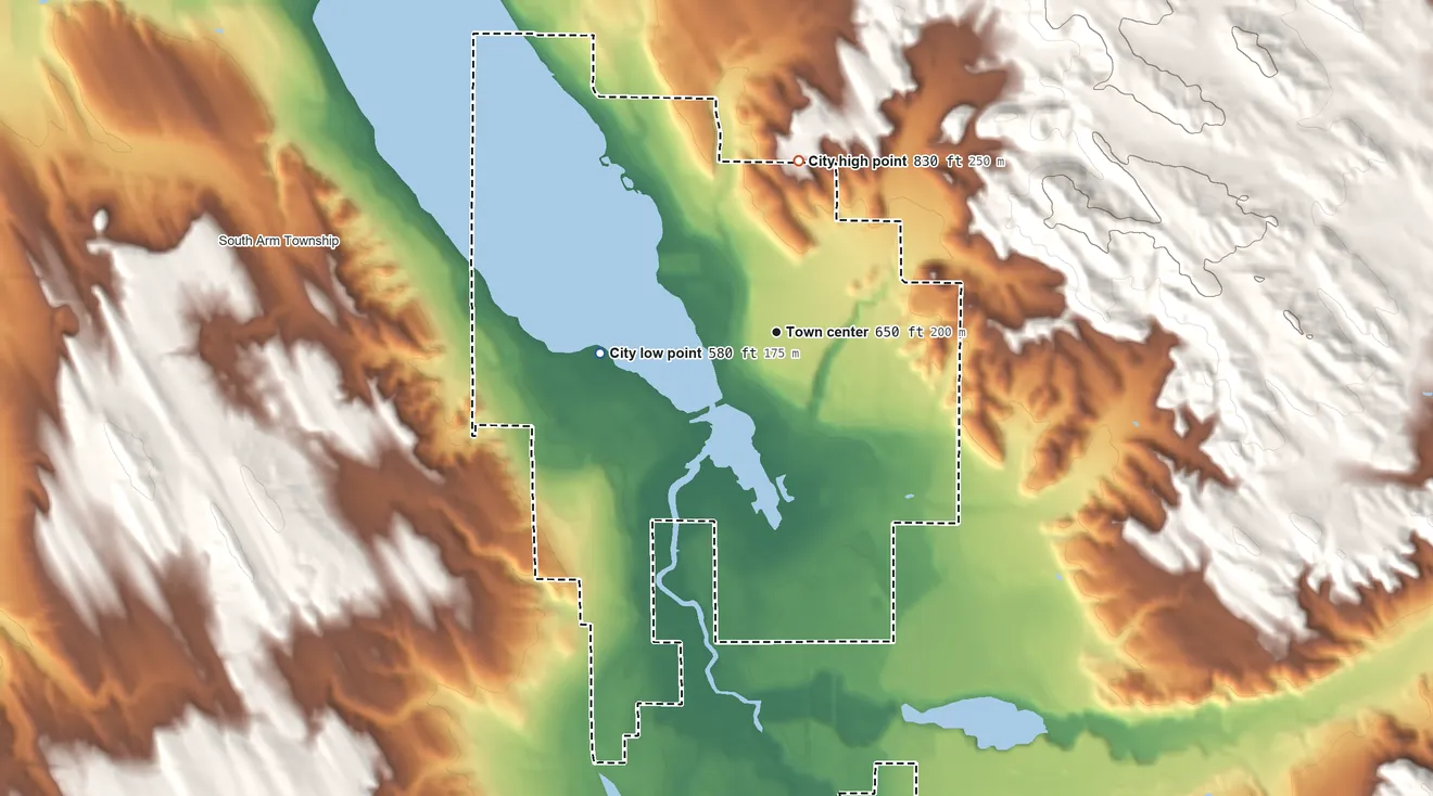Topographic elevation map of East Jordan, Michigan, shaded from 580 ft on the west side to 830 ft on the north side