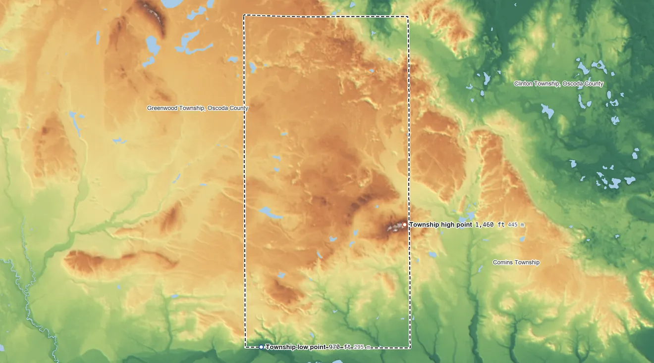 Topographic elevation map of Elmer Township, Michigan, shaded from 970 ft on the southwest side to 1,460 ft on Mount Tom