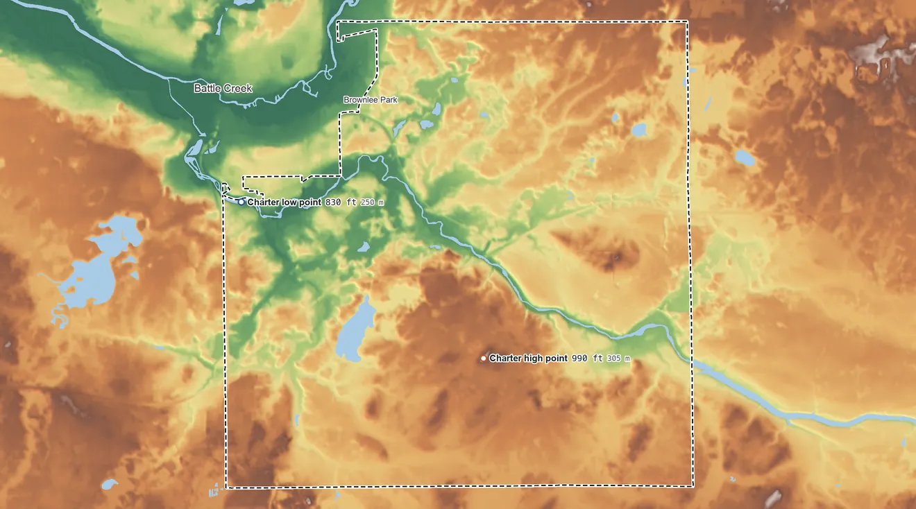 Topographic elevation map of Emmett Township, Michigan, shaded from 830 ft on the west side to 990 ft on the southeast side