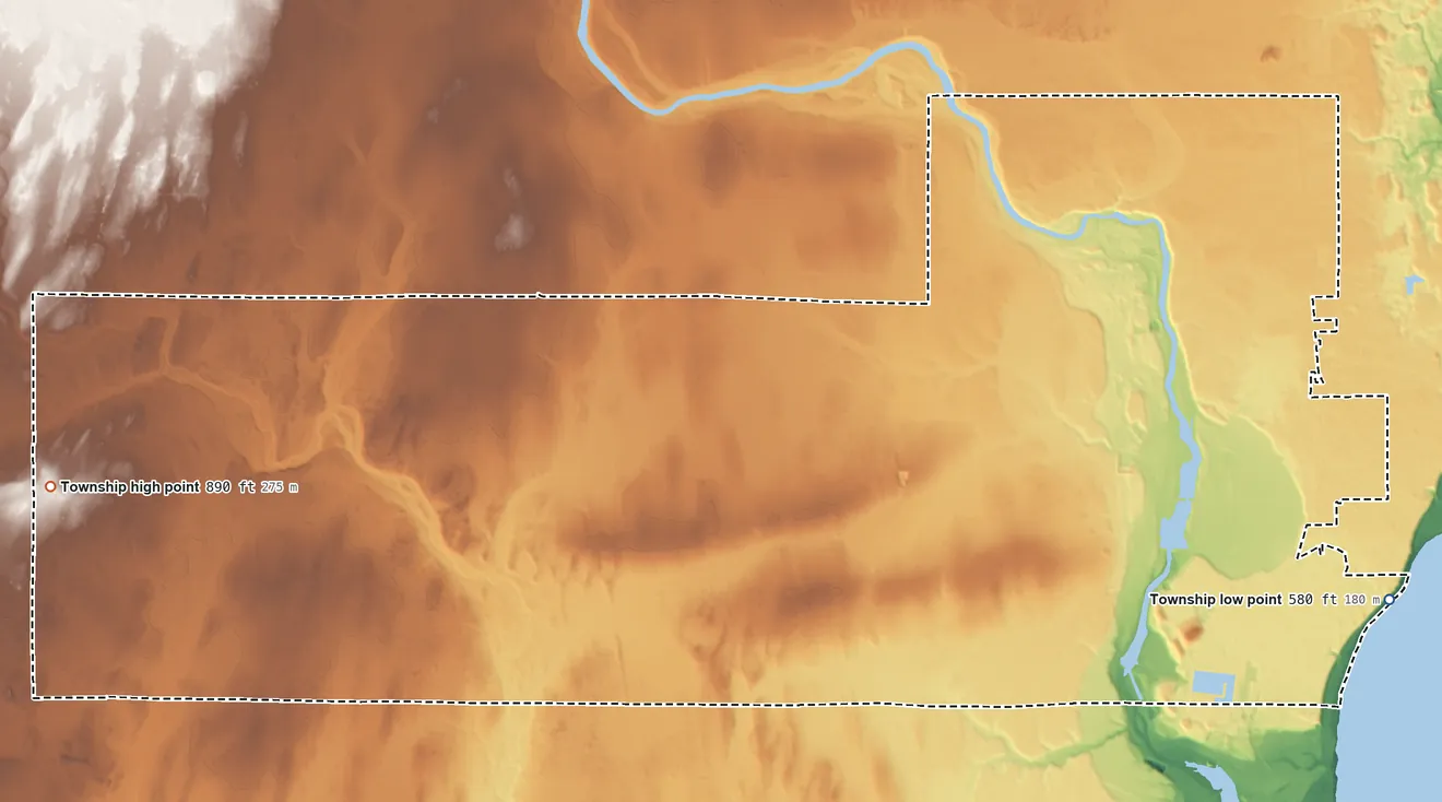 Topographic elevation map of Escanaba Township, Michigan, shaded from 580 ft on the southeast side to 890 ft on the west side
