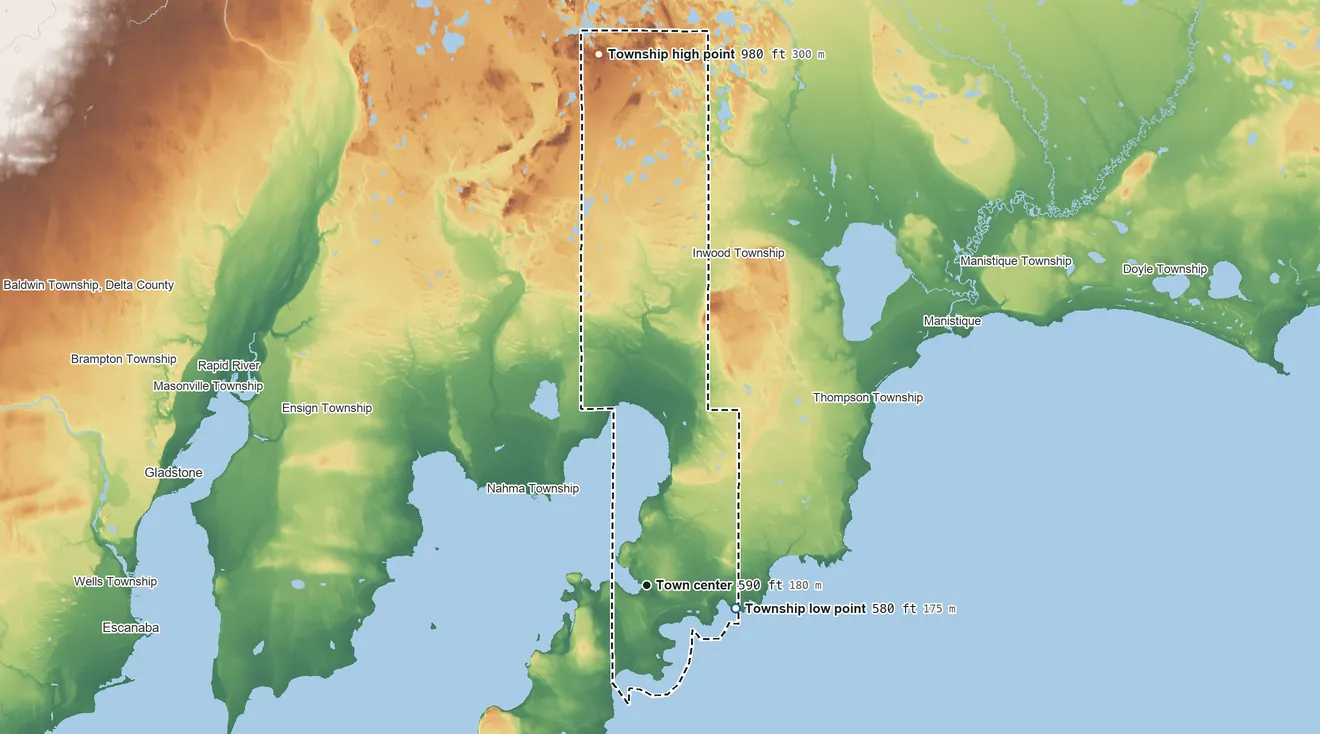 Topographic elevation map of Garden Township, Michigan, shaded from 580 ft on the shore of Lake Michigan to 980 ft on the north side