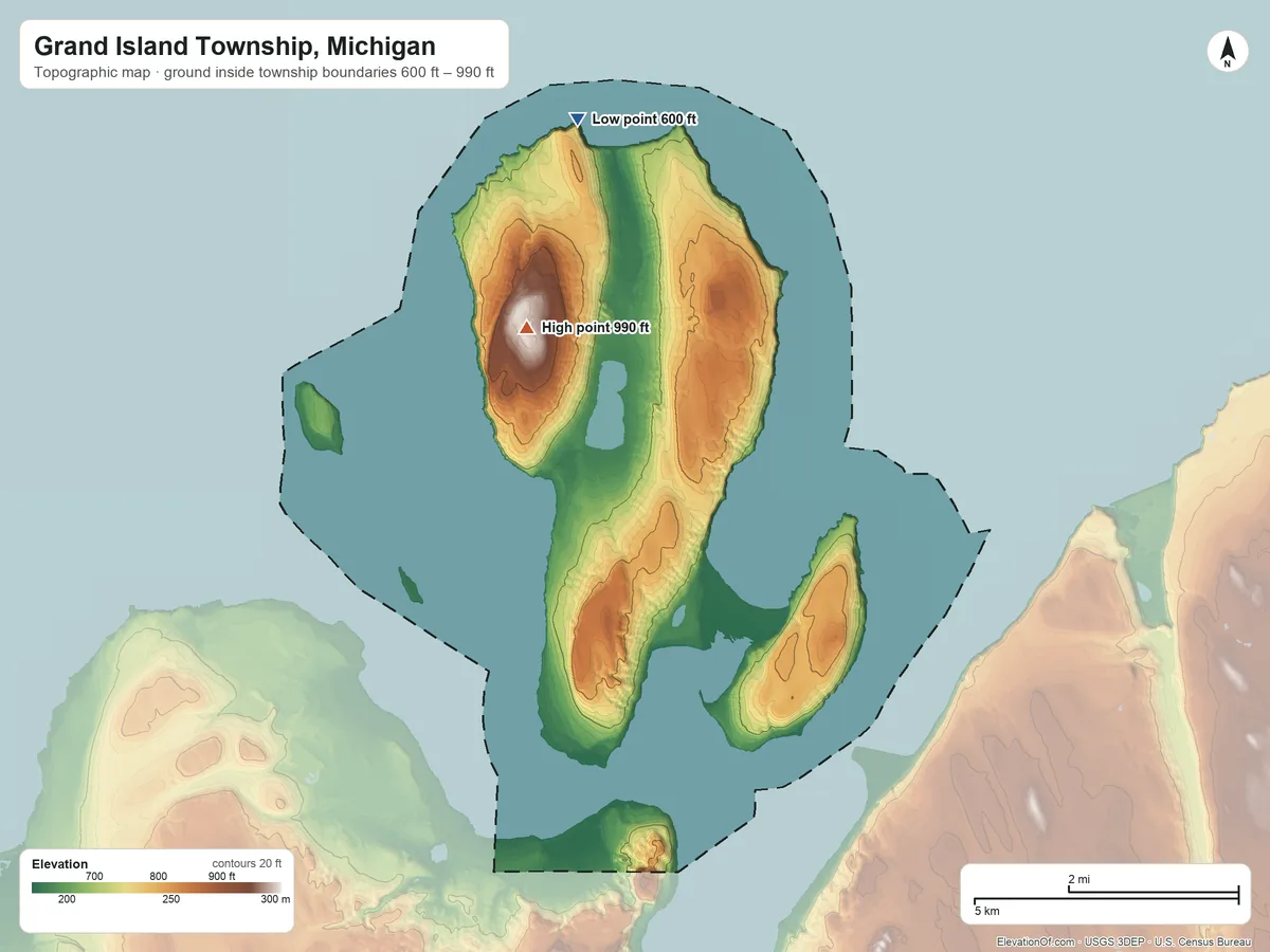 Topographic elevation map of Grand Island Township, Michigan, shaded from 600 ft on the north side to 990 ft on the north side