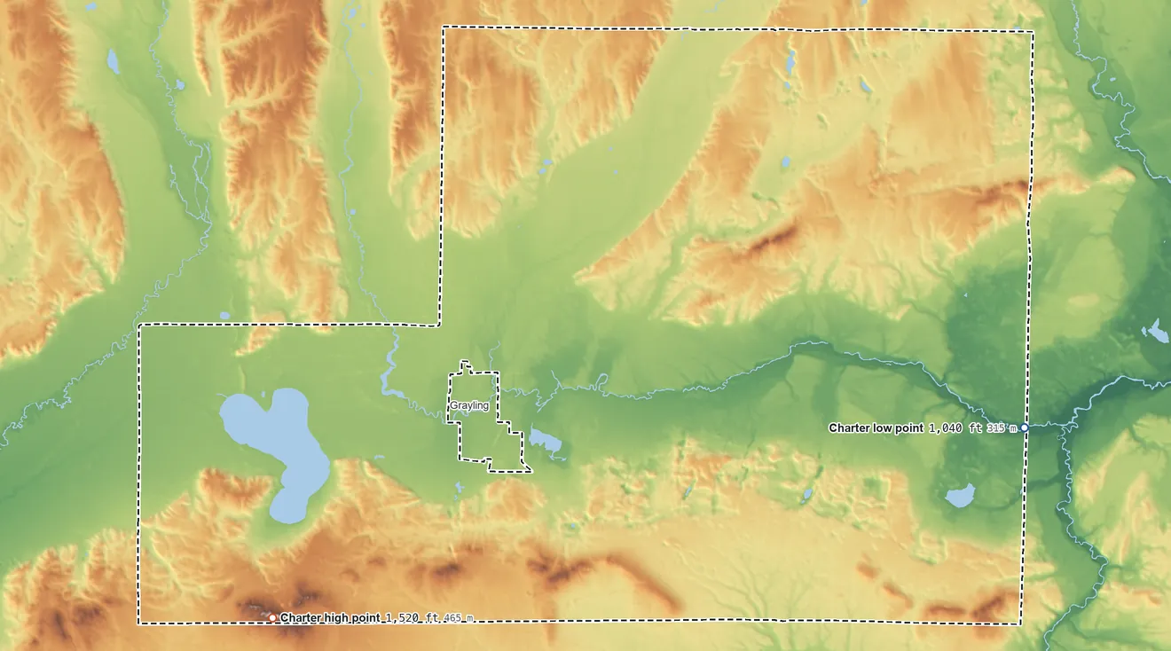 Topographic elevation map of Grayling Township, Michigan, shaded from 1,040 ft on the east side to 1,520 ft on Cote Dame Marie