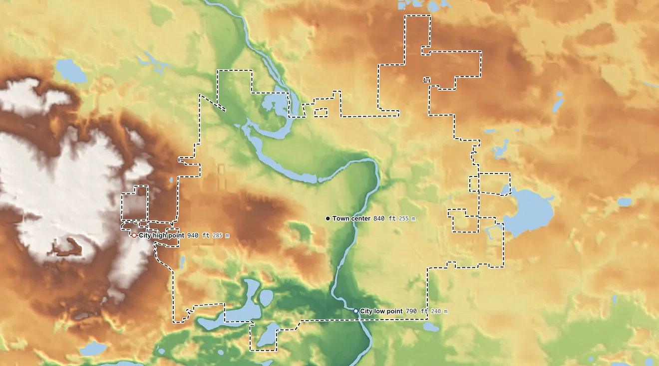 Topographic elevation map of Greenville, Michigan, shaded from 790 ft on the south side to 940 ft on the west side