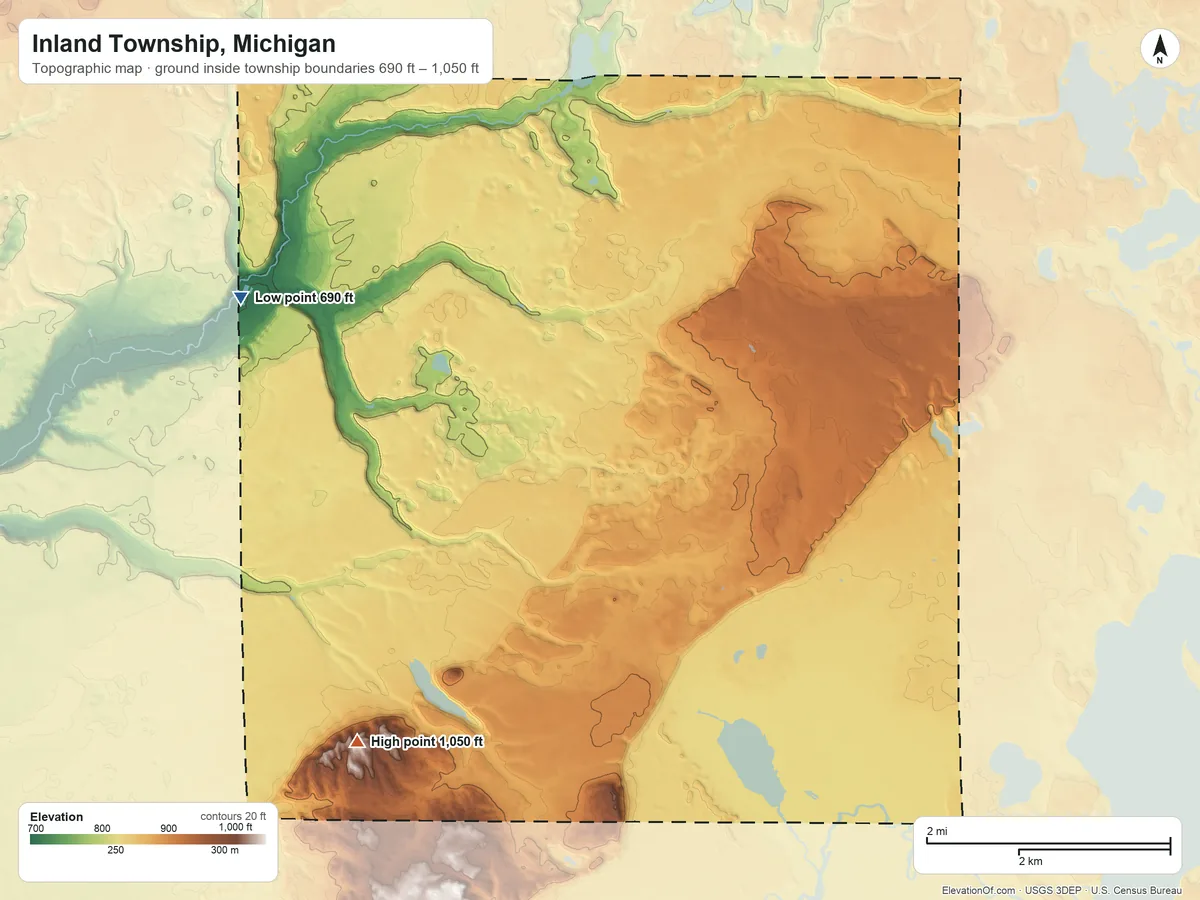 Topographic elevation map of Inland Township, Michigan, shaded from 690 ft on the west side to 1,050 ft on Turtle Lake Hill