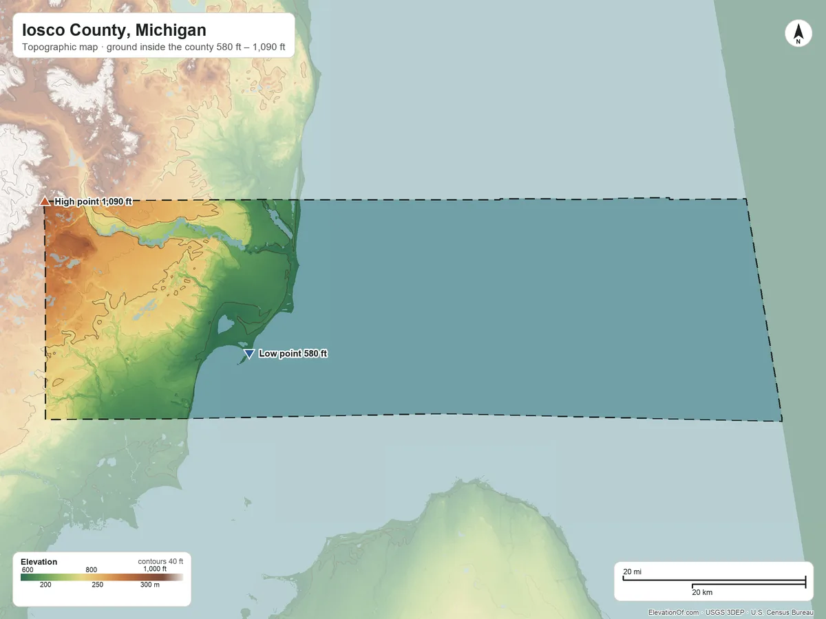 Topographic elevation map of Iosco County, Michigan, shaded from 580 ft on the west side to 1,090 ft on the west side