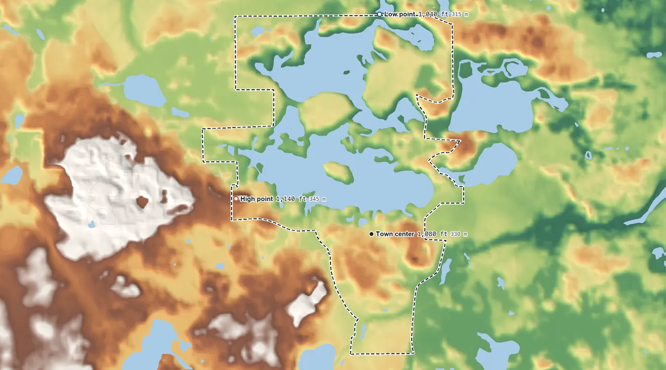 Topographic elevation map of Lake LeAnn, Michigan, shaded from 1,040 ft on the north side to 1,140 ft on the west side