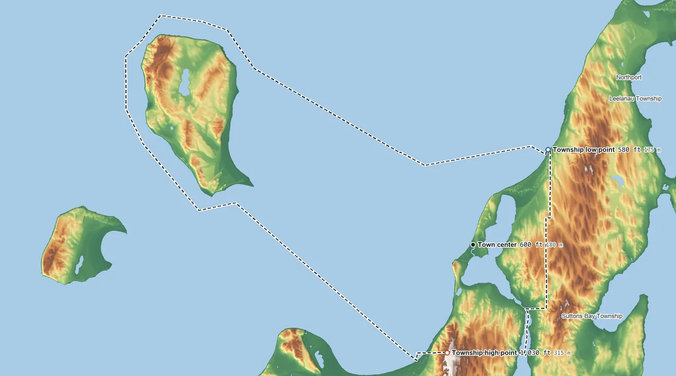 Topographic elevation map of Leland Township, Michigan, shaded from 580 ft on the northeast side to 1,030 ft on the south side
