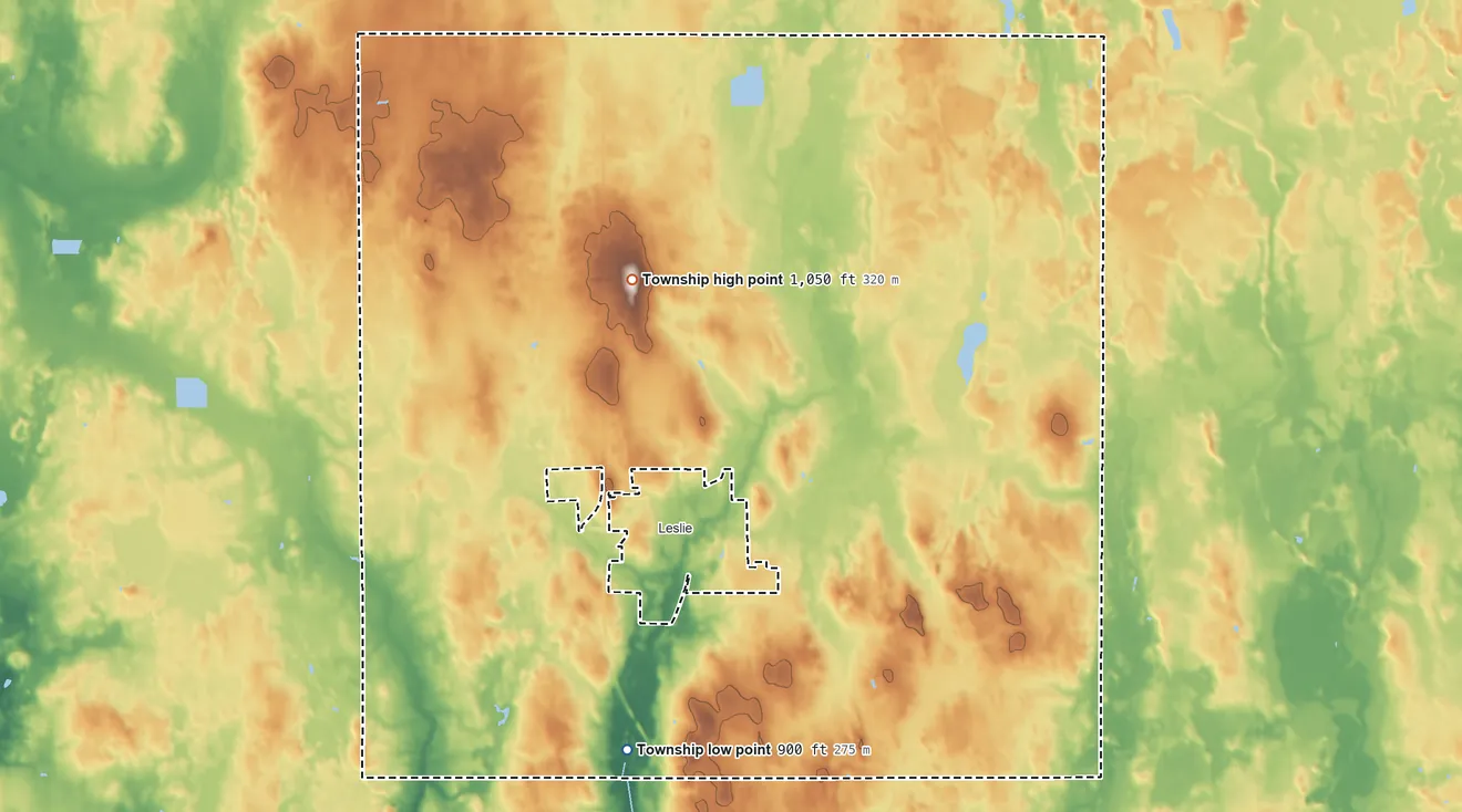 Topographic elevation map of Leslie Township, Michigan, shaded from 900 ft on the south side to 1,050 ft on Teaspoon Hill