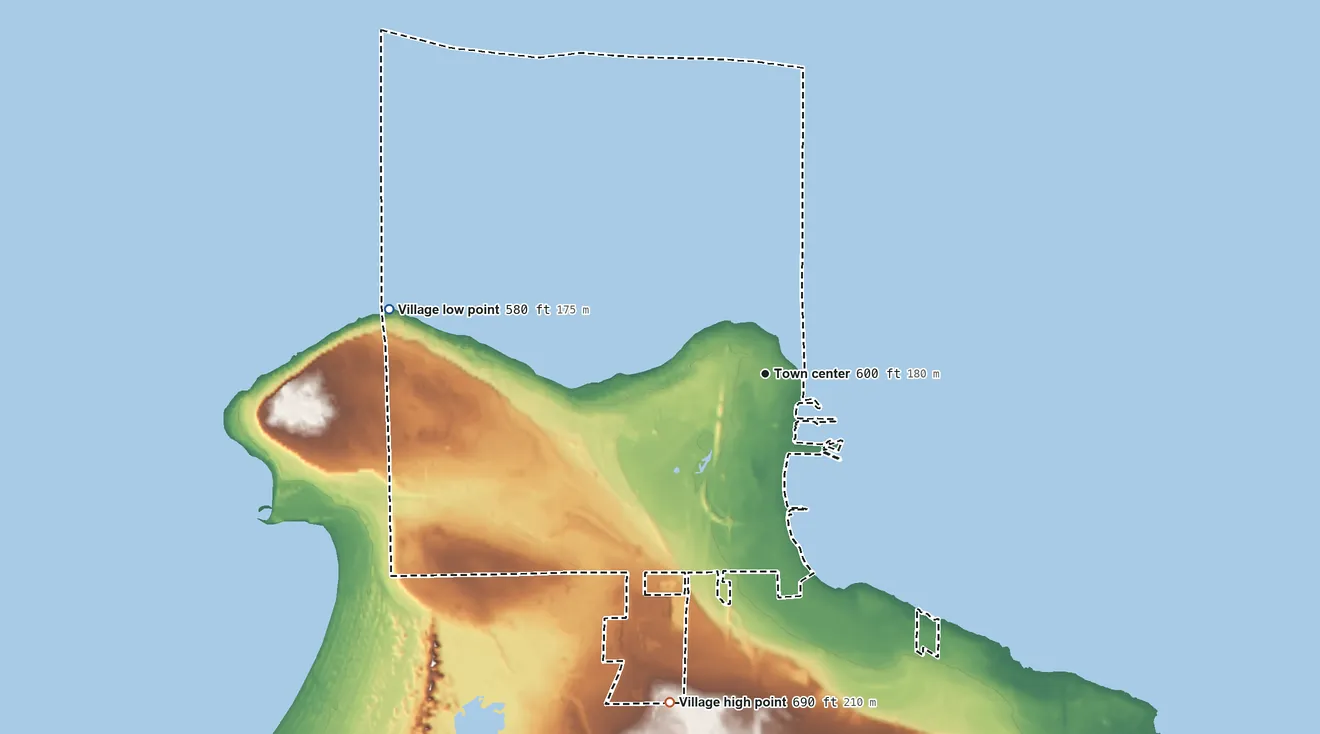 Topographic elevation map of Mackinaw City, Michigan, shaded from 580 ft on the west side to 690 ft on the south side