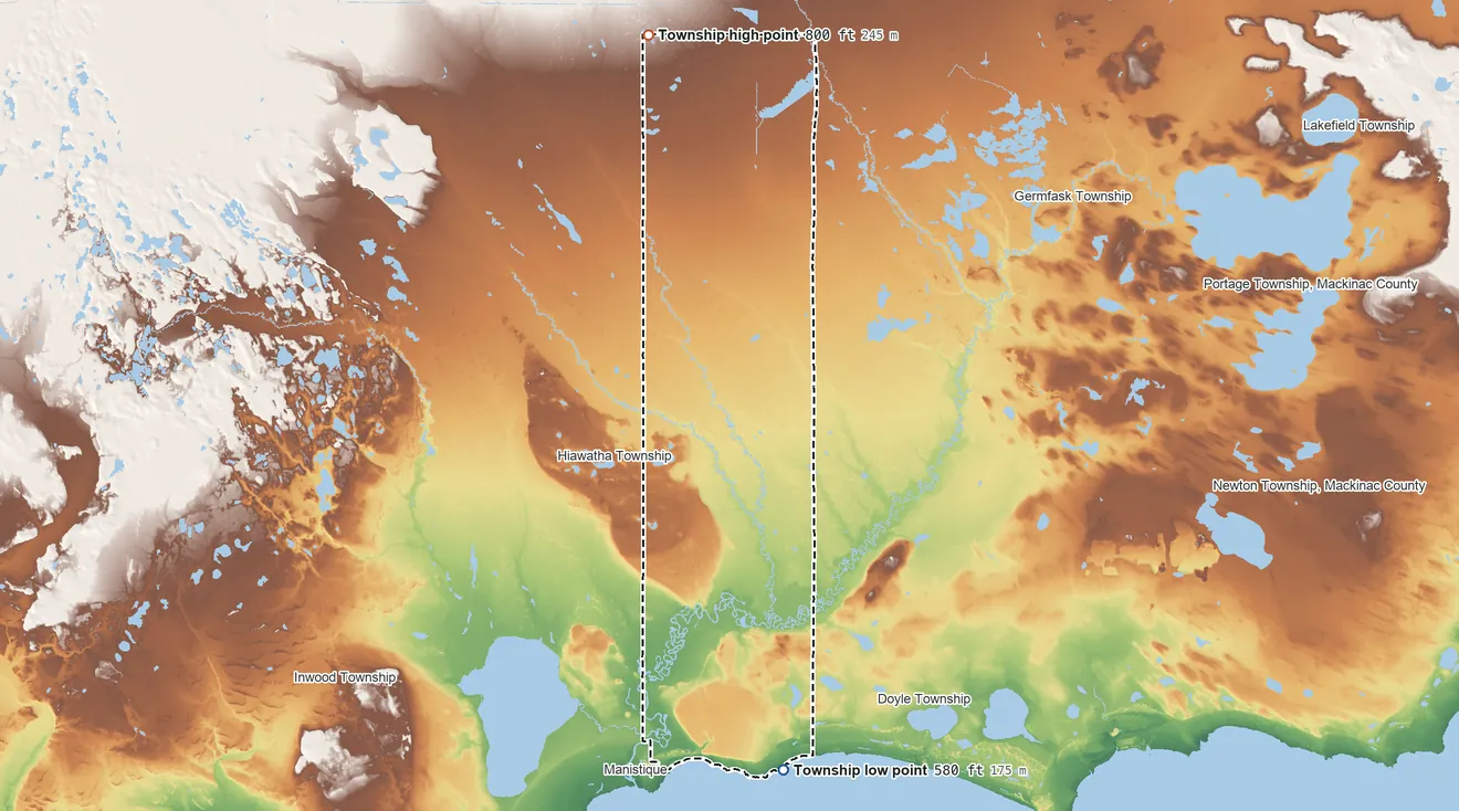 Topographic elevation map of Manistique Township, Michigan, shaded from 580 ft on the shore of Lake Michigan to 800 ft on the north side