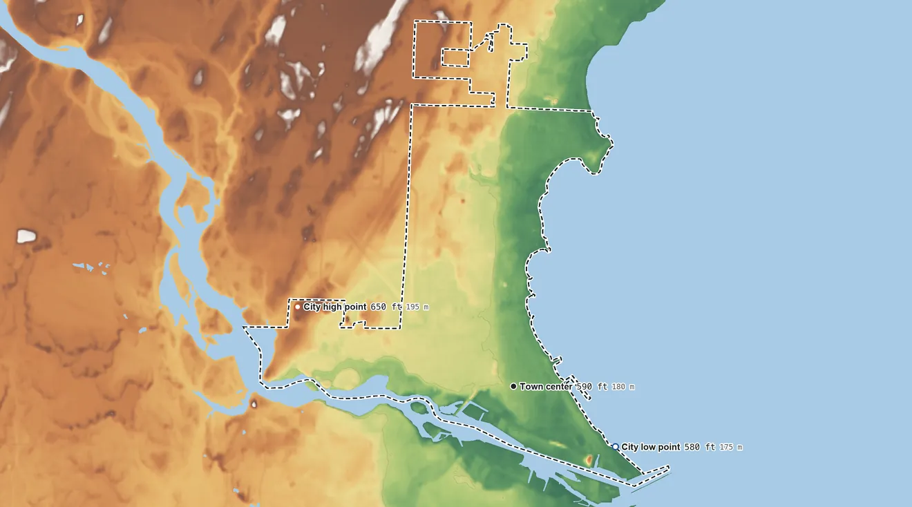 Topographic elevation map of Menominee, Michigan, shaded from 580 ft on the southeast side to 650 ft on the west side