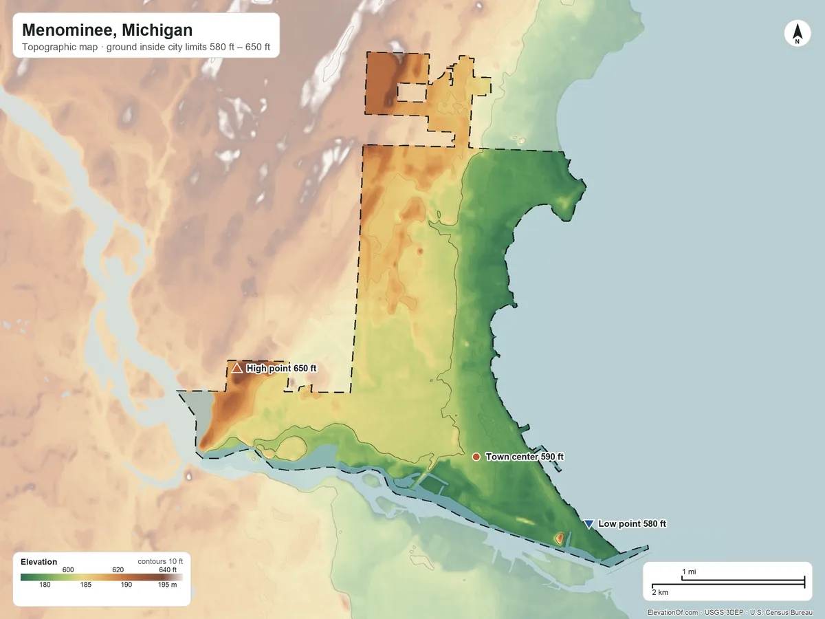 Topographic elevation map of Menominee, Michigan, shaded from 580 ft on the southeast side to 650 ft on the west side