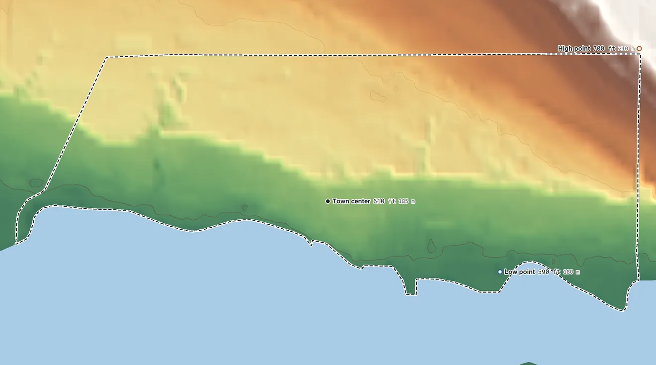 Topographic elevation map of Oden, Michigan, shaded from 590 ft on the east side to 700 ft at the foot of the Chandler Hills