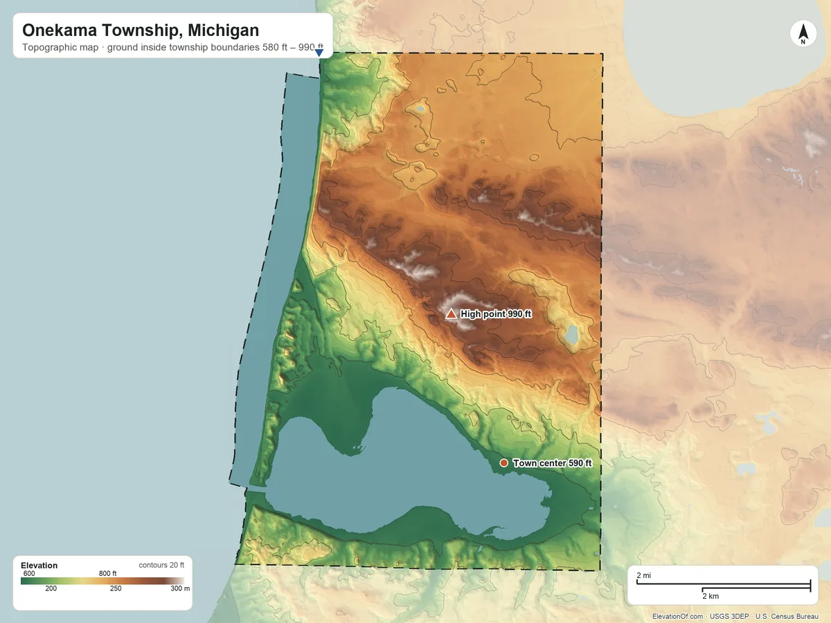 Topographic elevation map of Onekama Township, Michigan, shaded from 580 ft on the northwest side to 990 ft on the north side