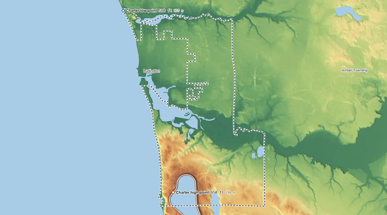 Topographic elevation map of Pere Marquette Township, Michigan, shaded from 580 ft on the northwest side to 950 ft on the south side