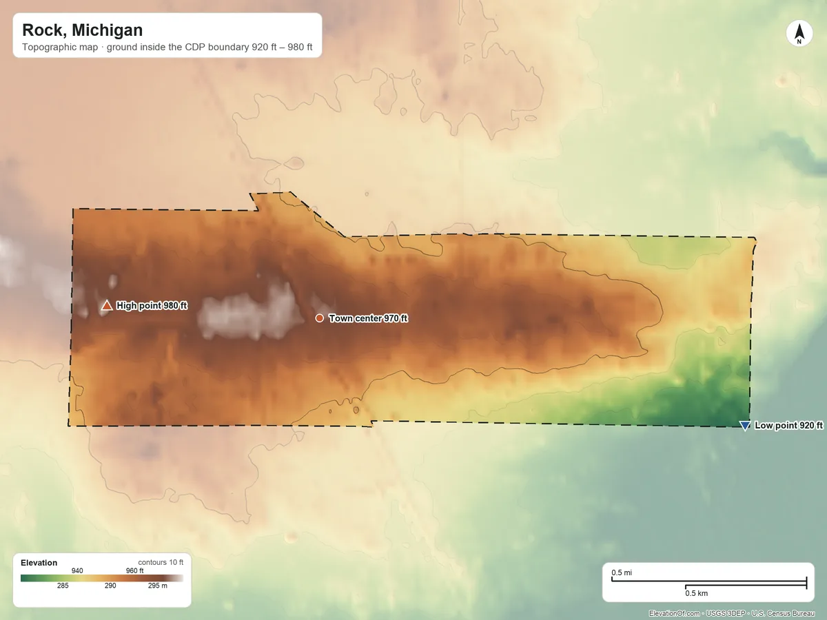 Topographic elevation map of Rock, Michigan, shaded from 920 ft on the east side to 980 ft on the west side