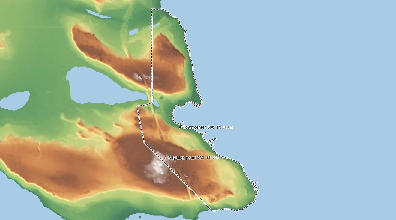 Topographic elevation map of St. Ignace, Michigan, shaded from 580 ft near the middle to 730 ft on the southwest side