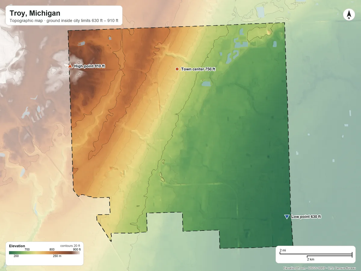 Topographic elevation map of Troy, Michigan, shaded from 630 ft on the southeast side to 910 ft on the west side