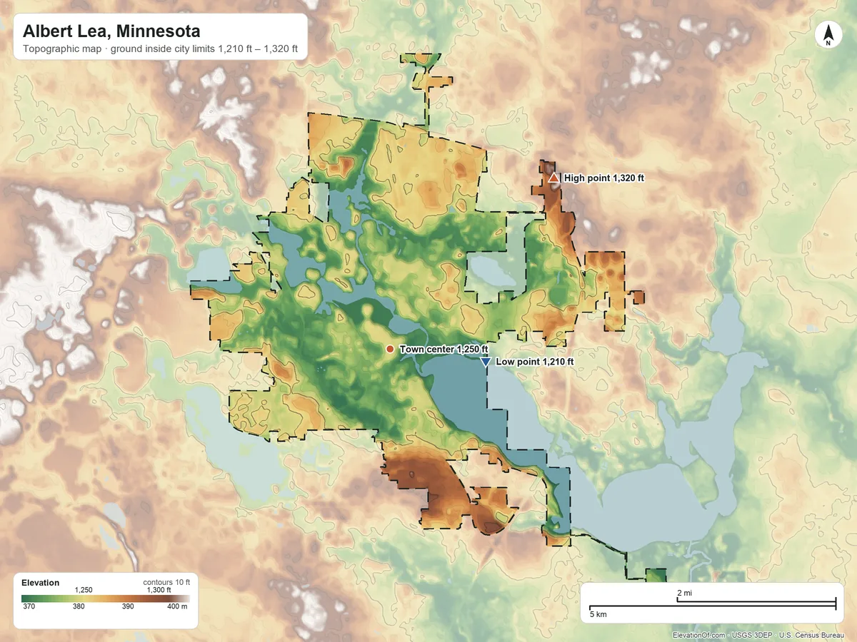 Topographic elevation map of Albert Lea, Minnesota, shaded from 1,210 ft on the east side to 1,320 ft on the northeast side